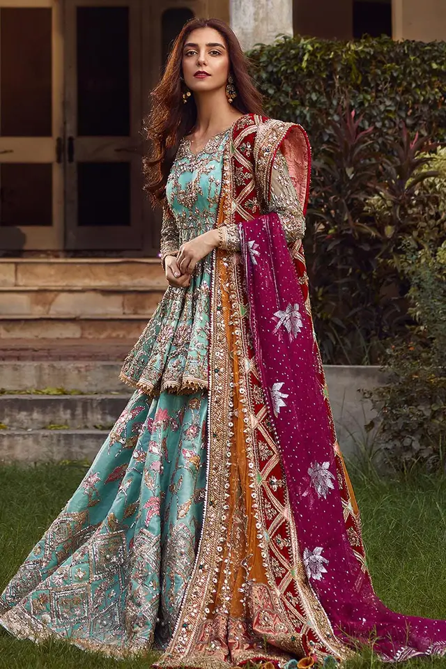 Full-length view of Ronaq Jahan sky-blue bridal lehenga choli with mustard and plum dupattas