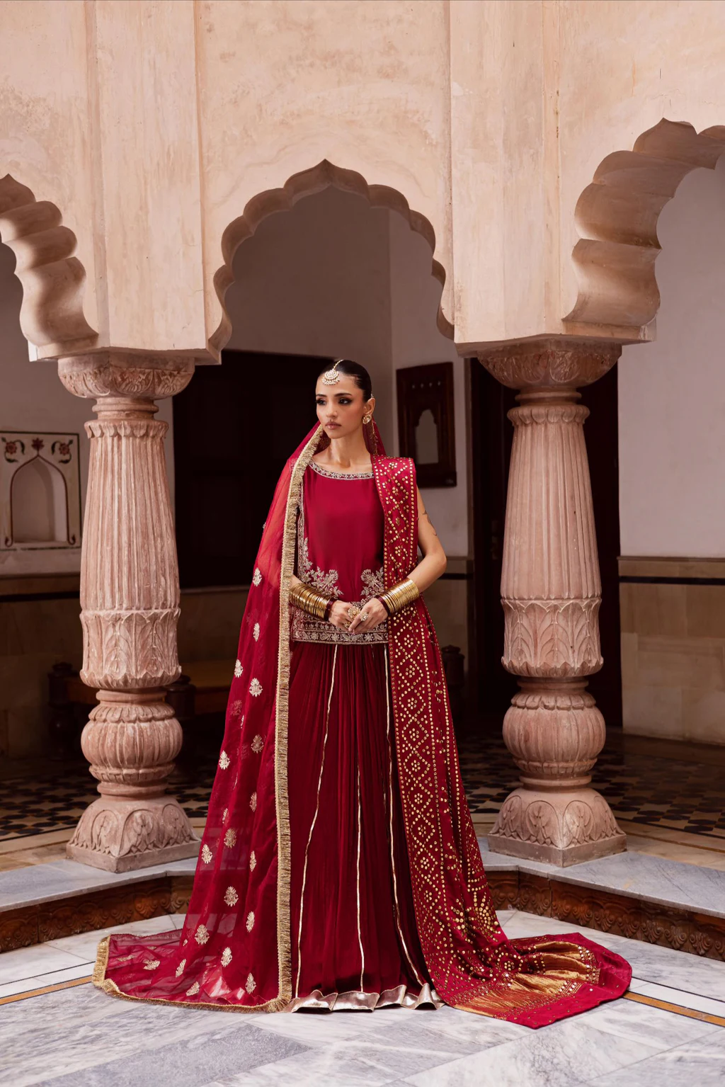 Eraya Aabroo reference model photo with crimson choli and lehenga