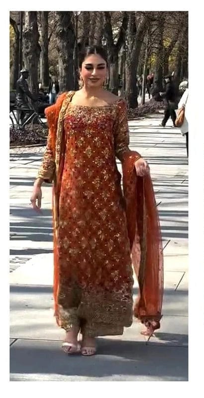 Haris Shakeel orange full-length primary view